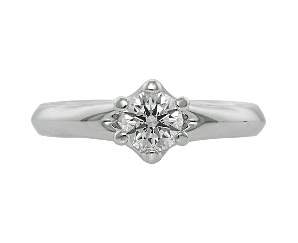 Corona white gold engagementั ring with a central diamond and details inspired by the shape of a crown.