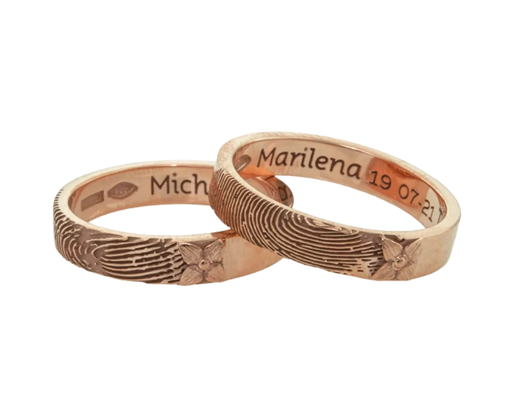 Bespoke rose gold wedding rings with engraved fingerprints and names on the inside, custom-made by Antonio Colonna
