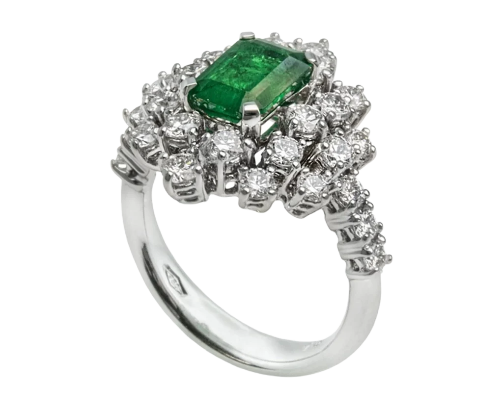 Mimosa ring with a central emerald and diamonds, side view of the handcrafted work