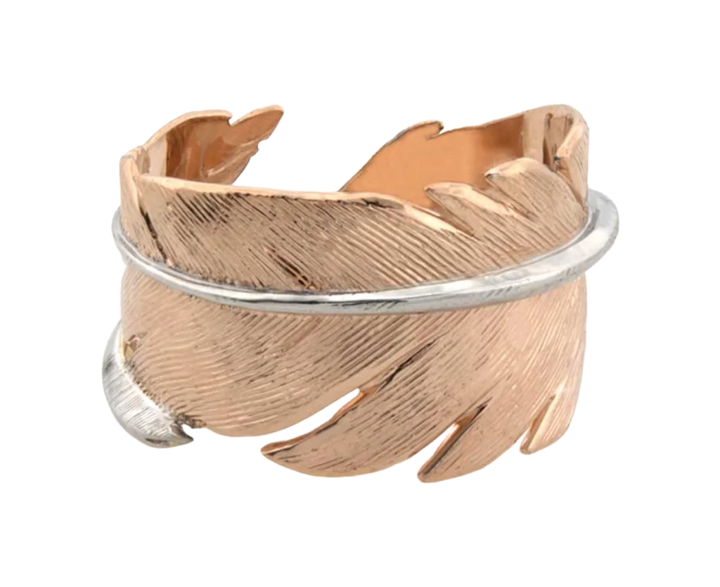 Open feather-shaped ring with engraved finish photographed on a transparent background